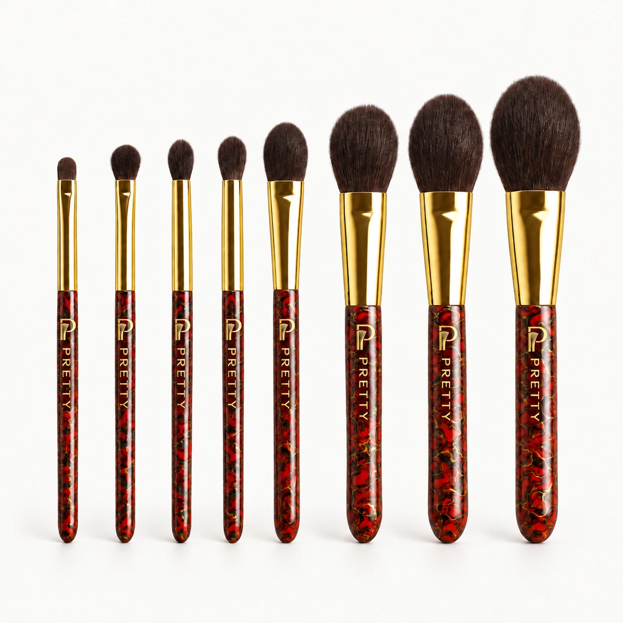 Eight upright red-and-black patterned brushes, with gold-tone ferrules and bristle heads at the top
