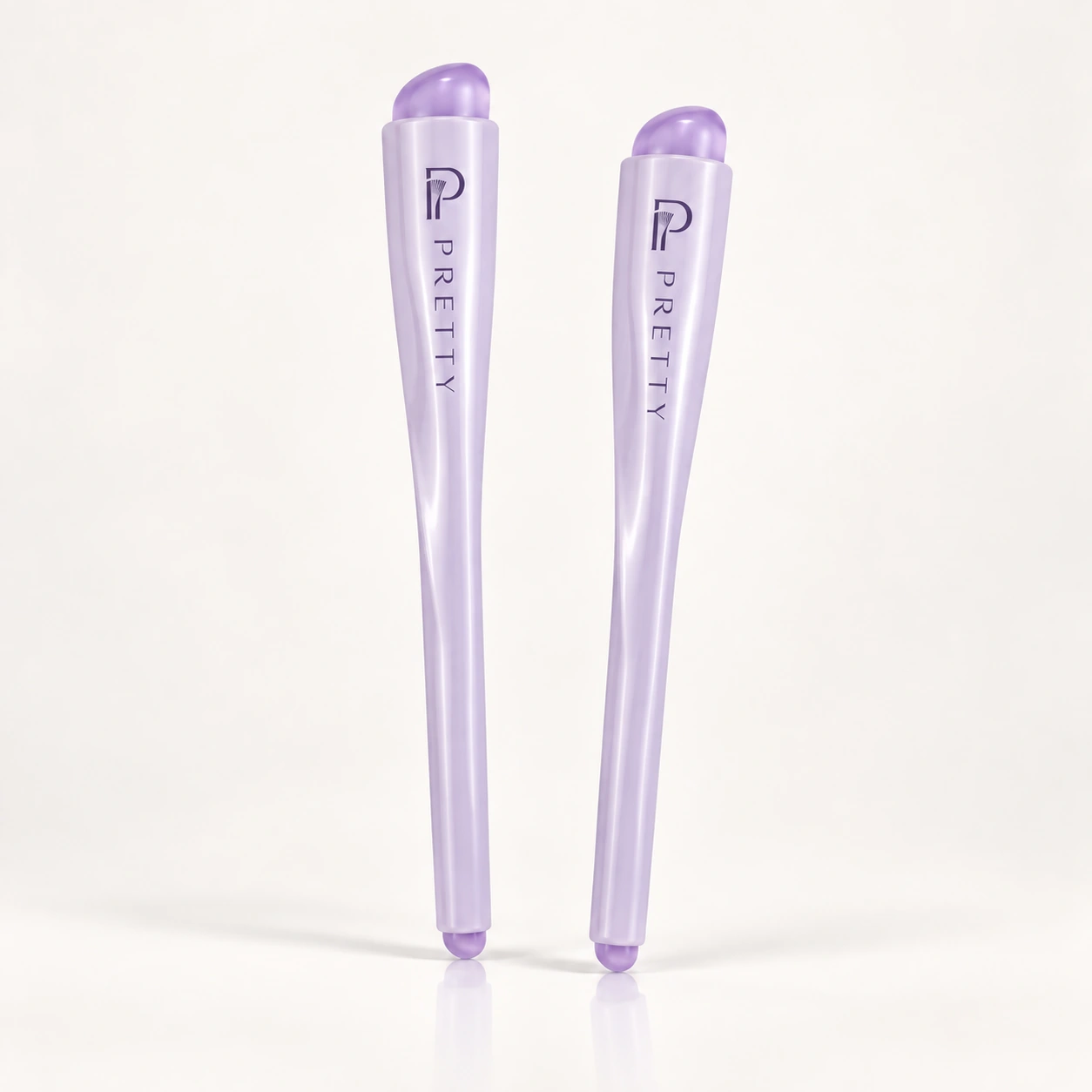 Two upright lilac double-ended applicators with both silicone ends visible