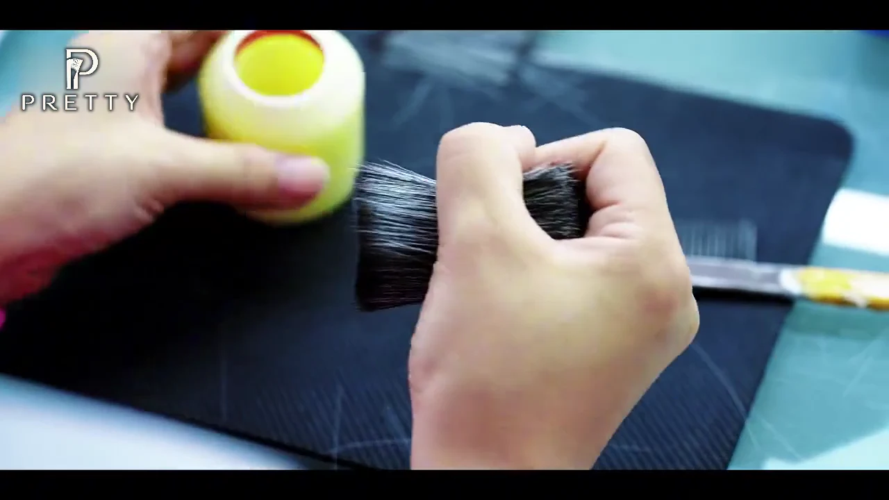Building the brush head by hand — still from the PRETTY factory film