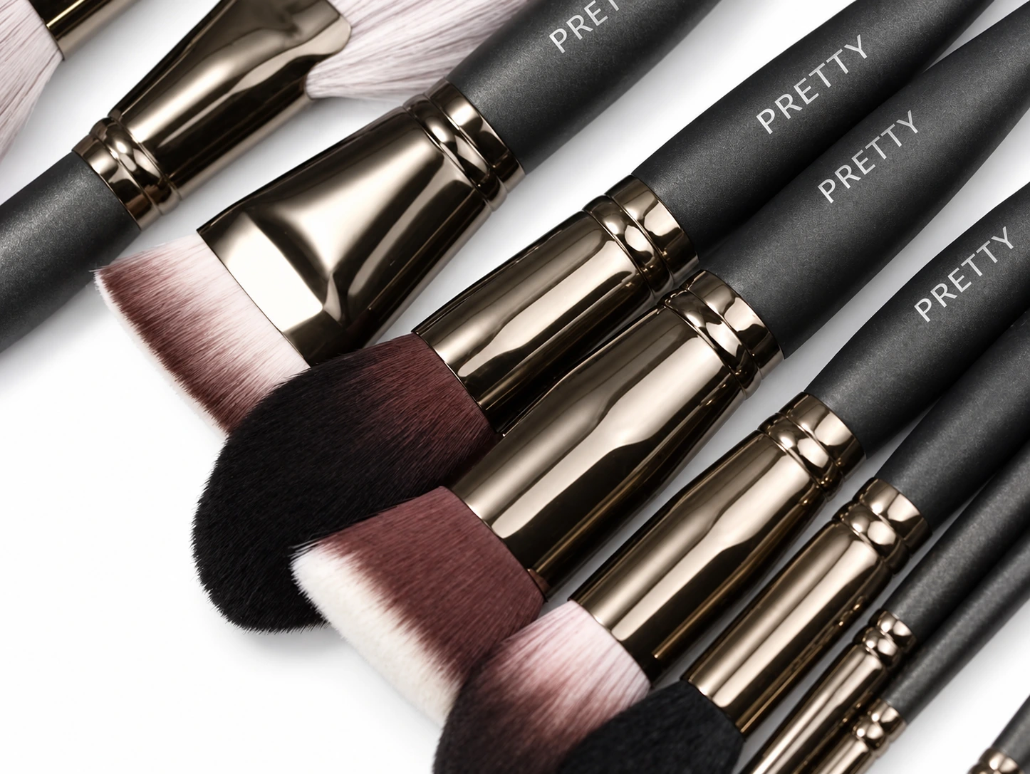 Dark-gray collection with cropped ferrule and handle details, produced brush design