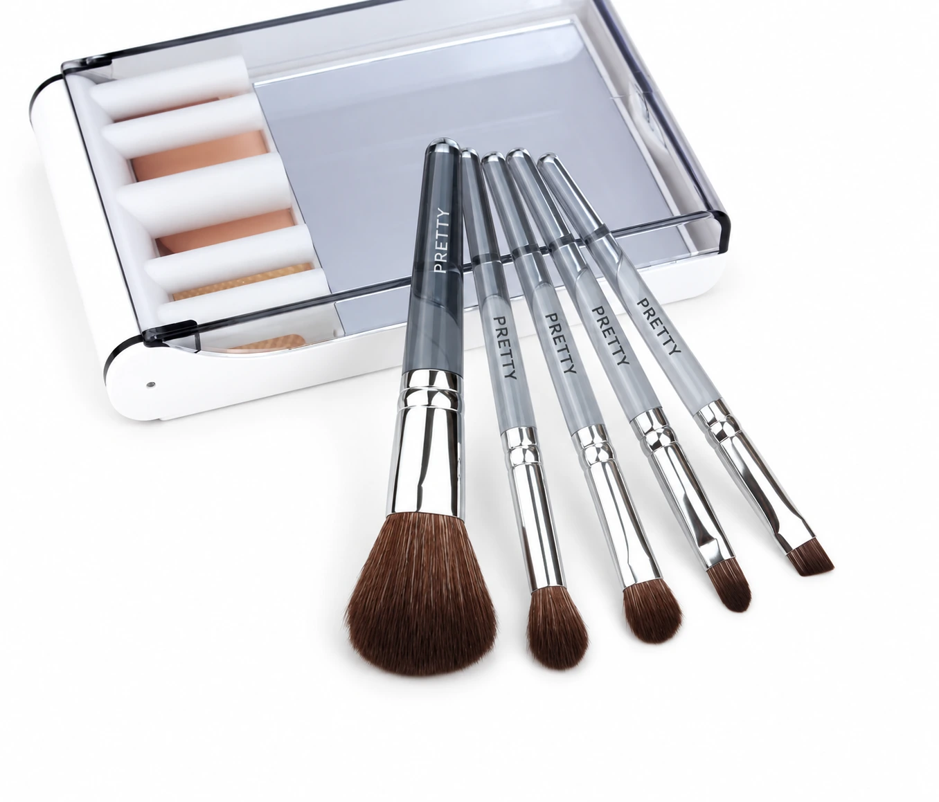 Five smoky-clear brushes with an open white case behind, produced brush design