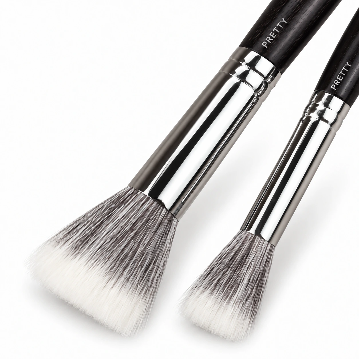Two gray-white layered brush heads with cropped dark handles, produced brush design