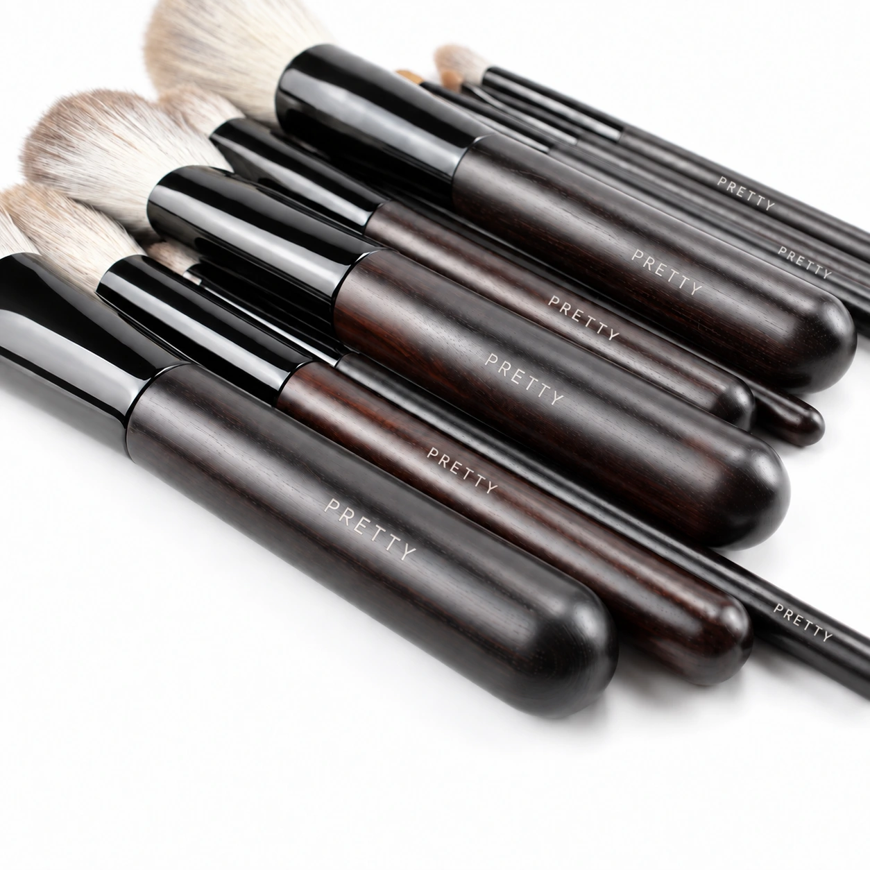 Overlapping dark grain-patterned handles in a close view, produced brush design
