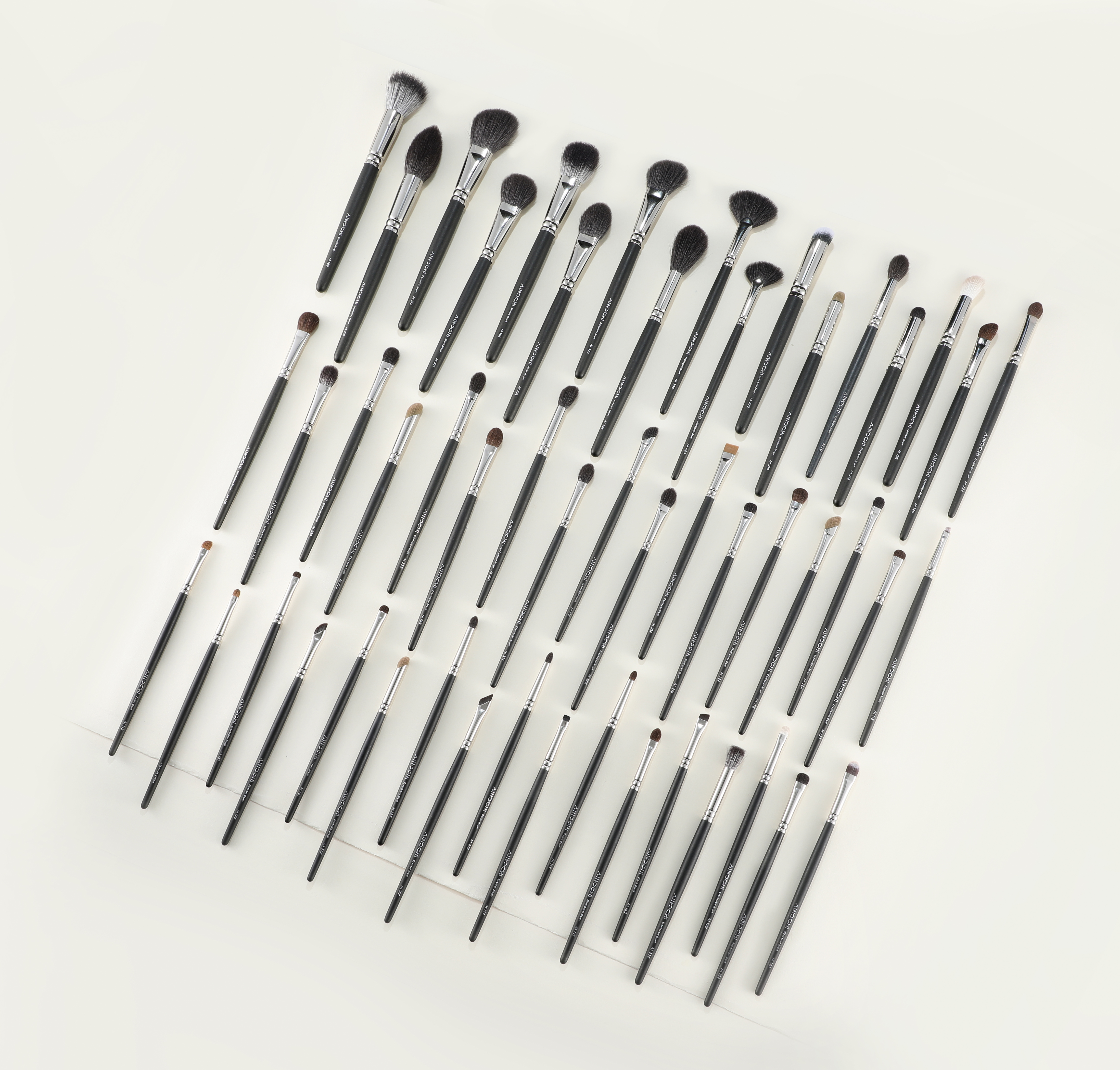 Original alternate photograph of the black professional brush collection laid out in a grid