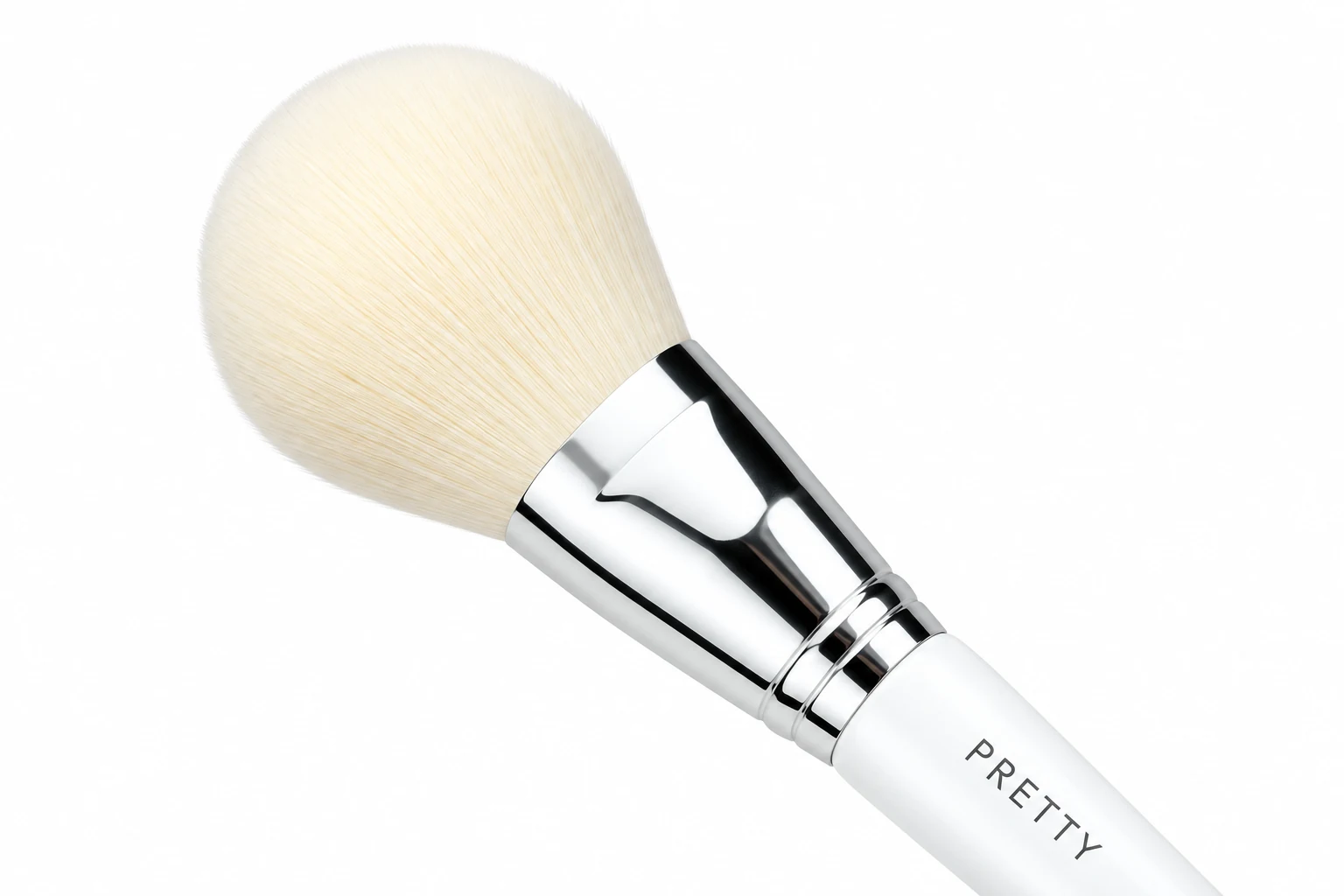 AI oblique detail of a rounded pale powder head with a polished silver ferrule