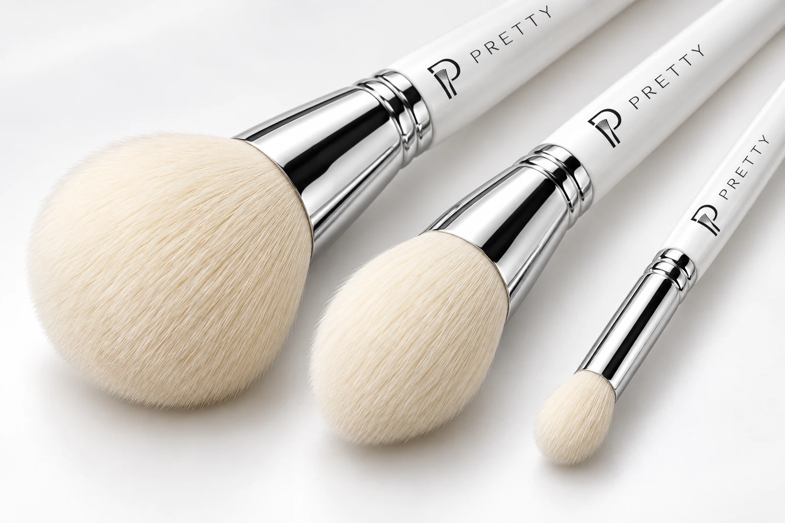 AI detail view of pale BH brush-head profiles with silver ferrules and white PRETTY handles