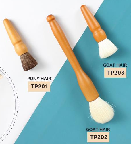 CAT-p052-wood-tools: Three orange-handle tool brushes
