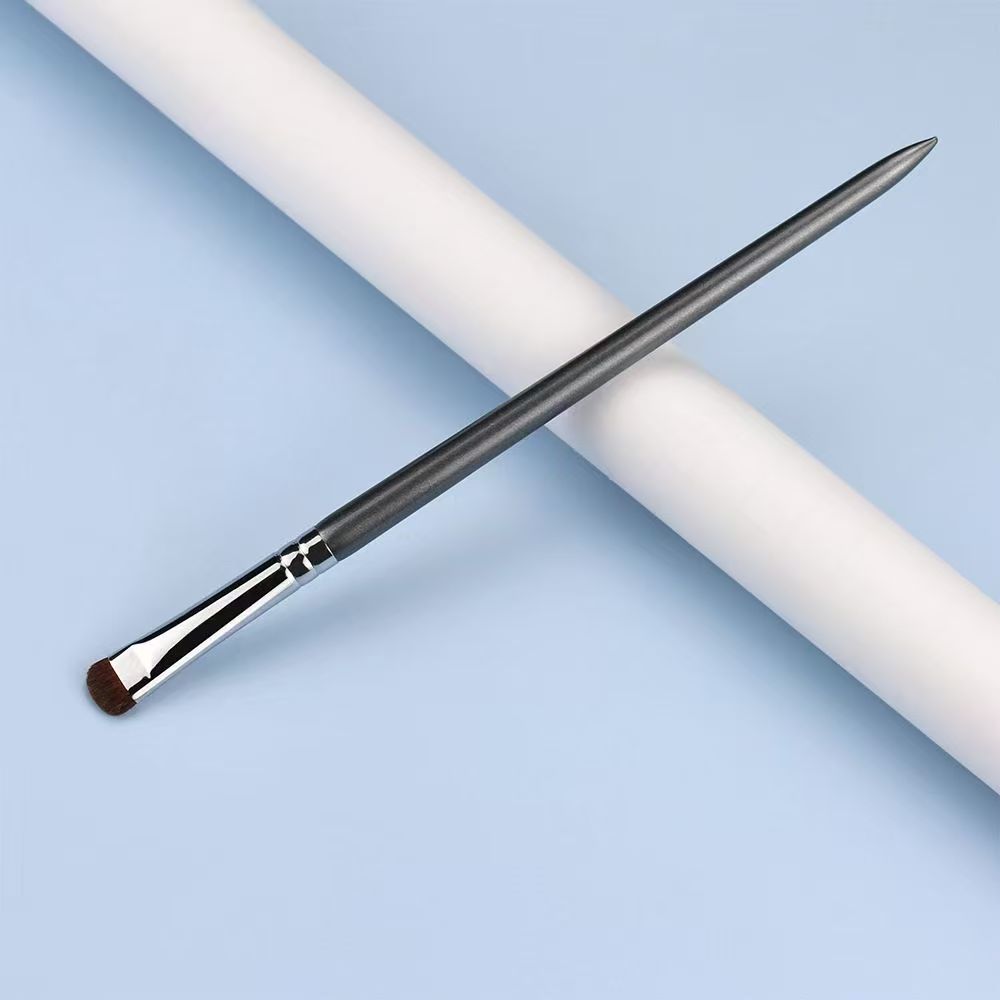 UP058: Slim gray handle and silver-tone ferrule with a small brown flat head