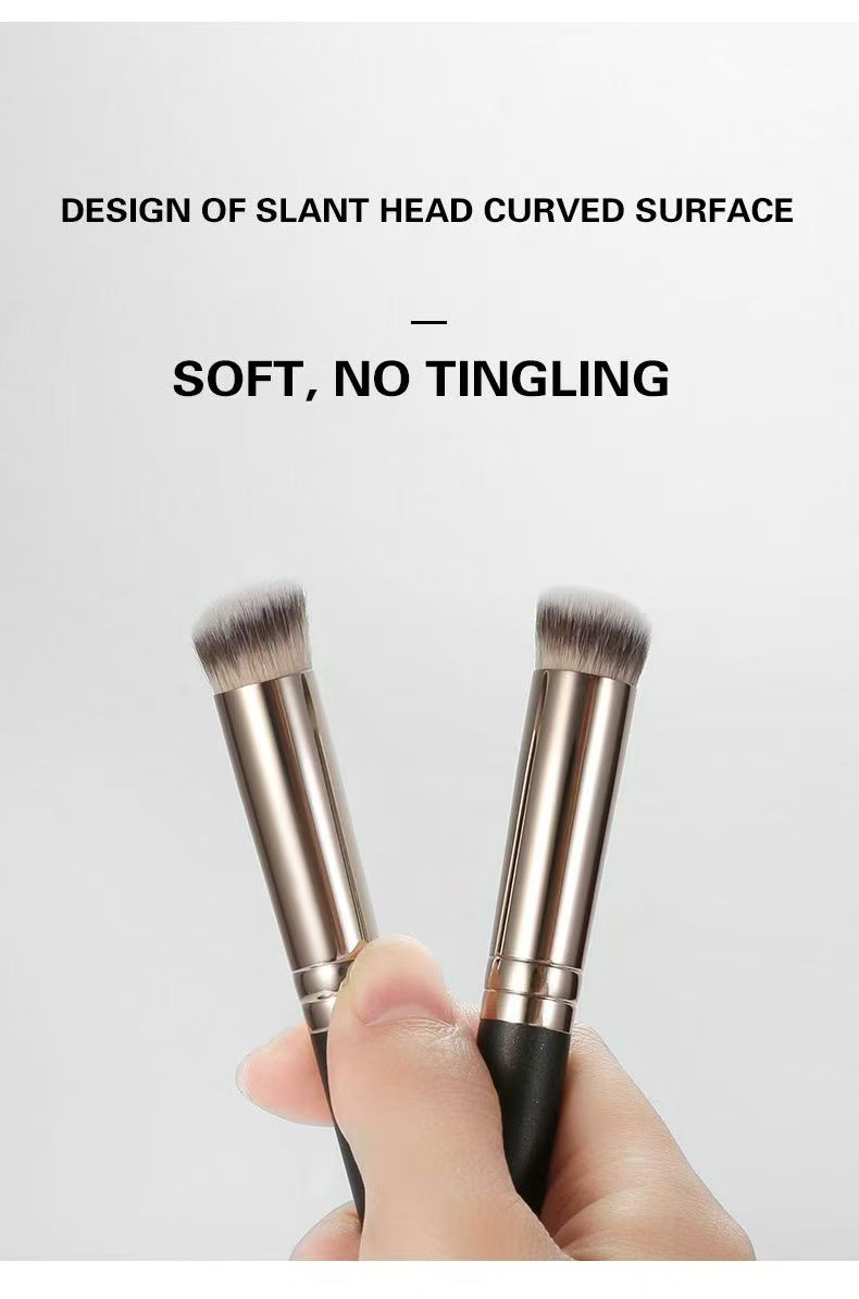 UP065: Hand-held view of two short angled brown-white brush heads