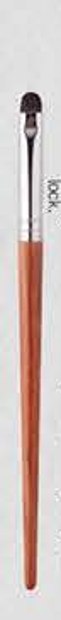 Lower-eyelid detail - Red-brown tapered handles, silver-tone ferrules, dark and white-tipped heads