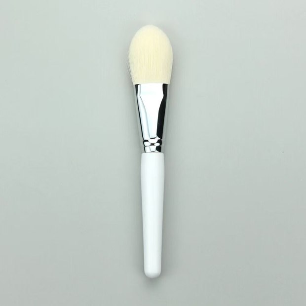 White-handle brush with a pointed pale oval head