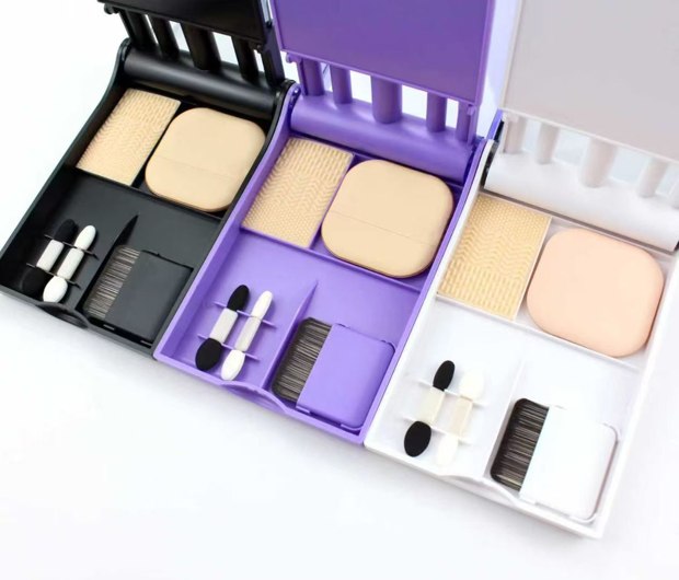 Accessory-tray details from three travel cases