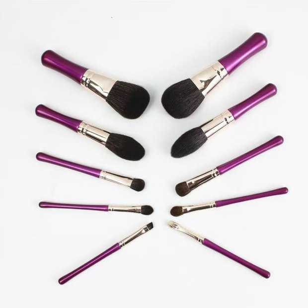 Ten magenta-handle brushes with pale warm-tone ferrules