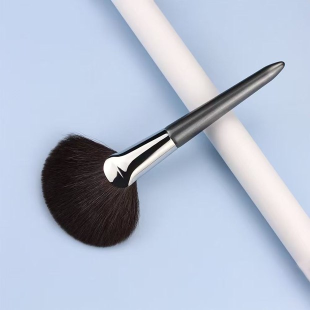 Gray handle and silver-tone ferrule with a broad dark fan head