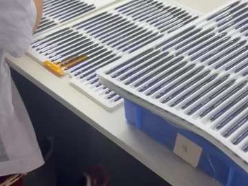 Slim brush components arranged in long tray slots
