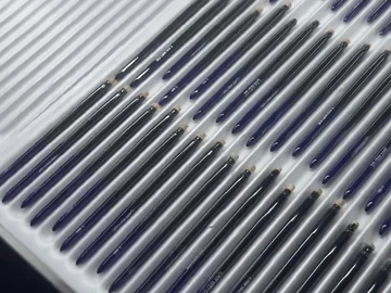 Close view of the long slotted component trays