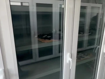 Glass-front cabinets along the workshop wall