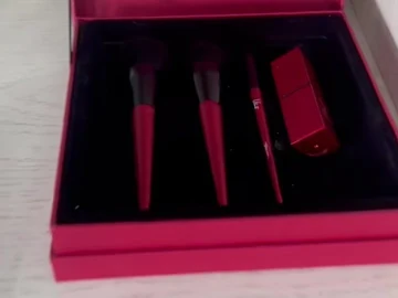 Brush collection inside a red presentation box