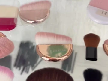 Sample display with palm and long-handle brushes