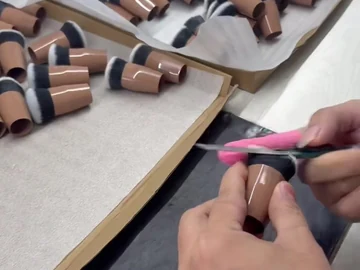 Close view of a hand tool and compact brush