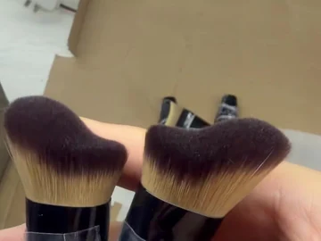Two angled compact brush samples held together