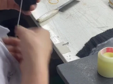 Close view of brush-head handling at the bench