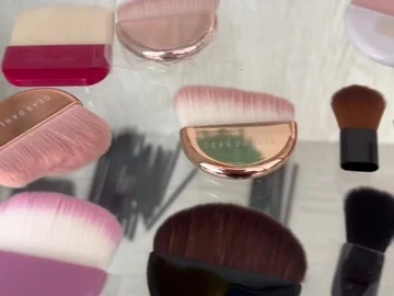 Palm brushes and small applicators in the display