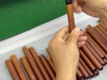 Hand checking the long brush beside a handle row