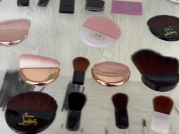 Palm brushes and slim applicators on display shelves